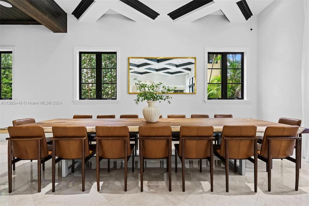 Dining room with a large wood table.
