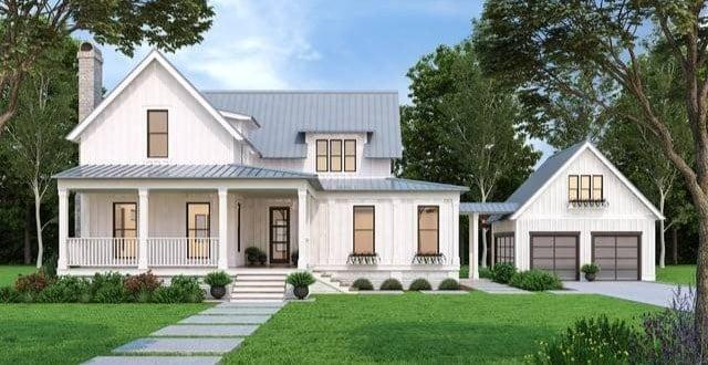 Classic Farmhouse Elegance with a Metal Roof and Detached Garage