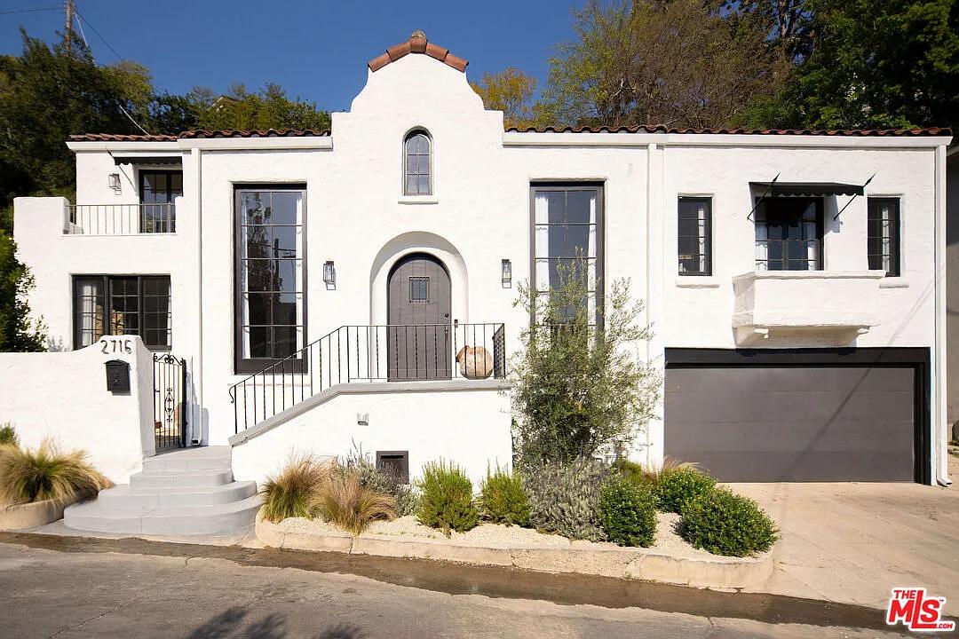 Spanish Colonial Revival with Arched Entryway