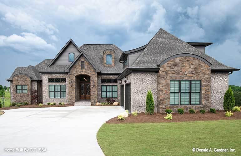 Check Out the Eye-Catching Rooflines in This Stone-Accented Home