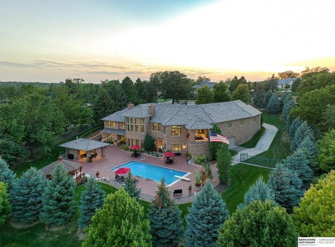 Expansive Brick Estate with a Sunlit Poolside Retreat