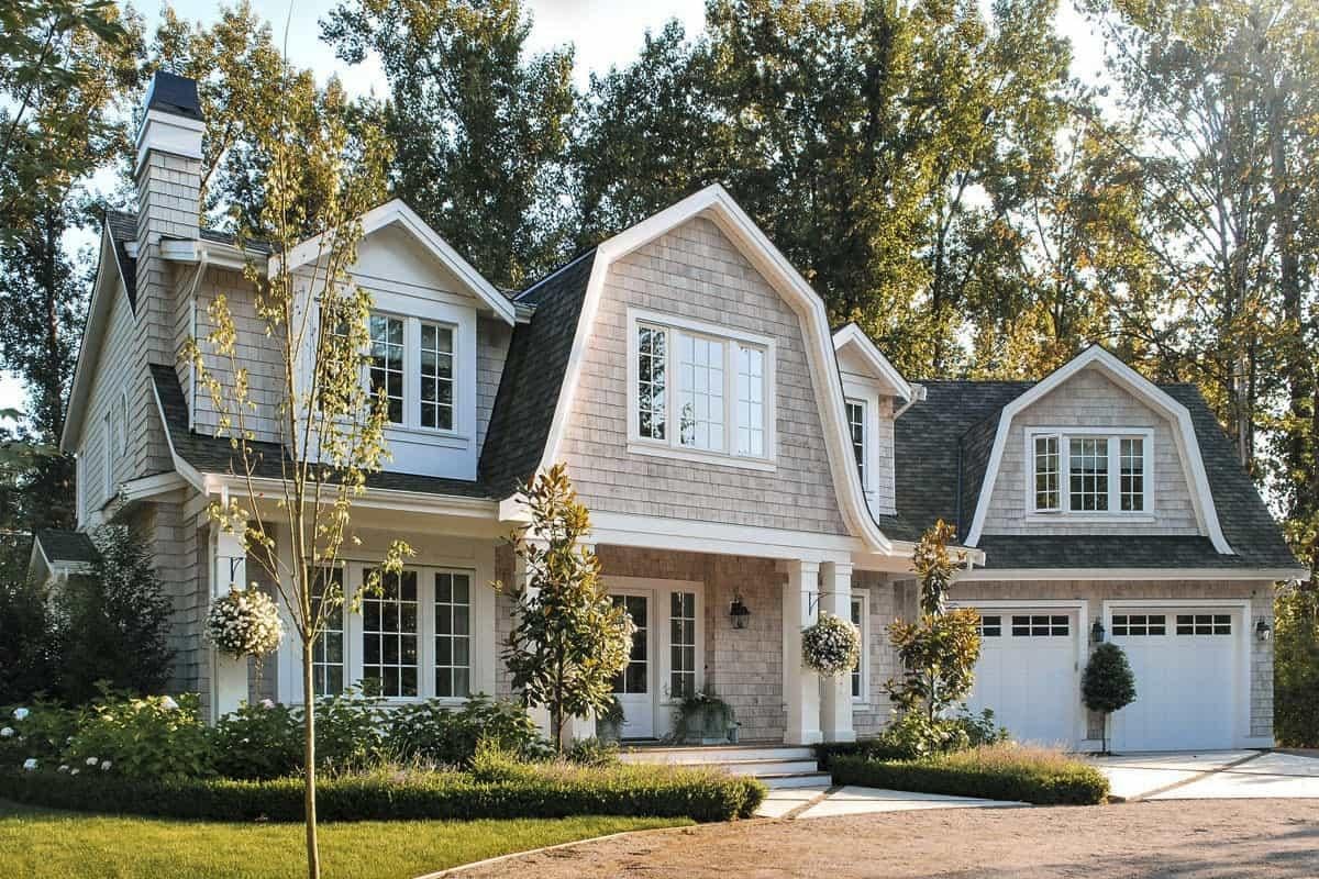 Cape Cod Charm with Elegant Dormers and Symmetrical Design