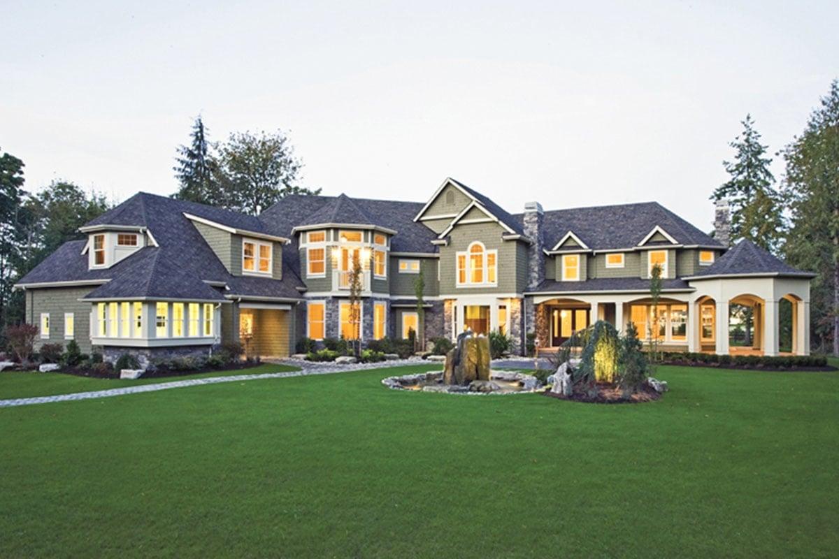 Check Out This Grand Facade with Stone Accents and Arched Windows
