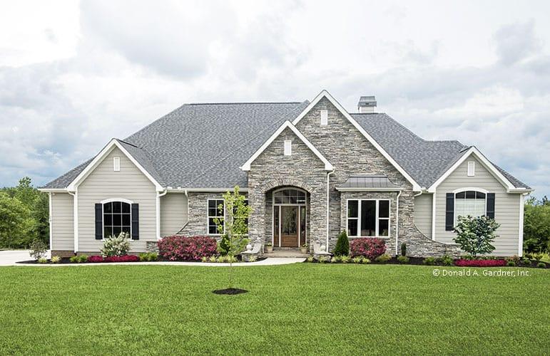 Charming Ranch with Stone Facade and Dormer Accents
