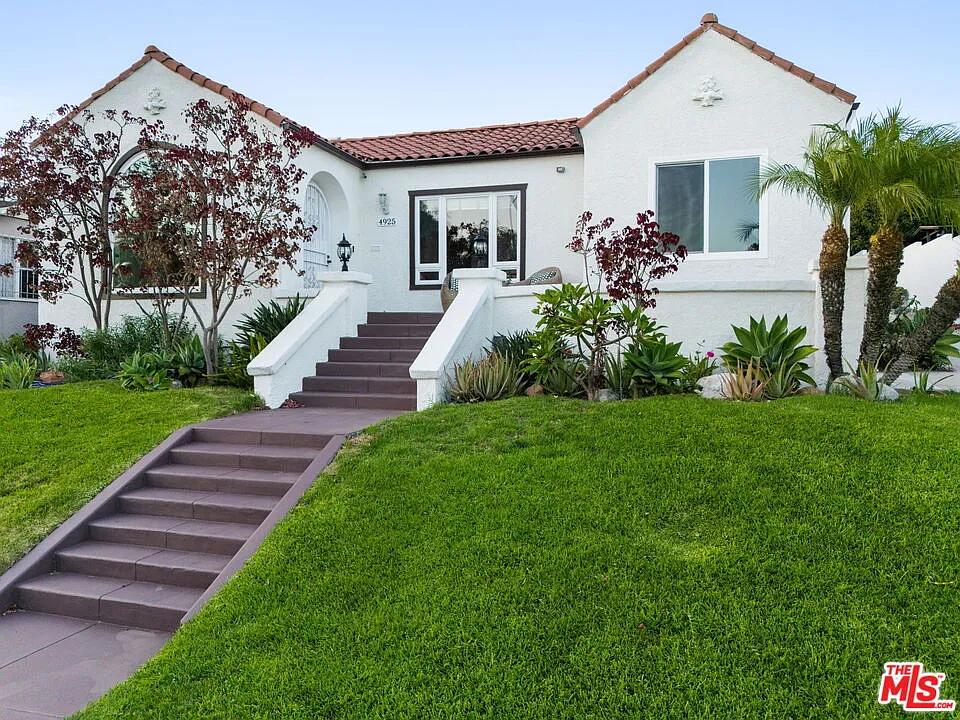 Classic Spanish Revival Home with Inviting Red Tile Roof