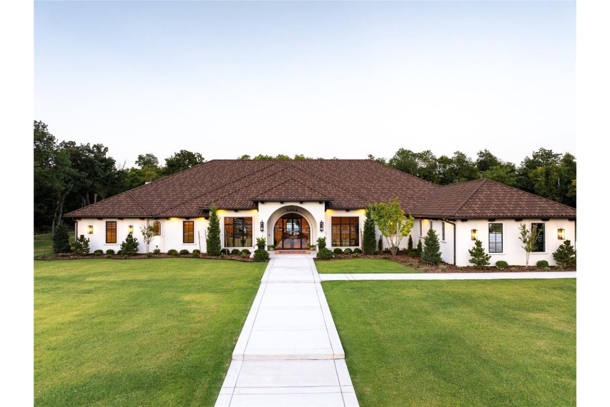 Notice the Beautiful Arched Entry in This Mediterranean-Inspired Home