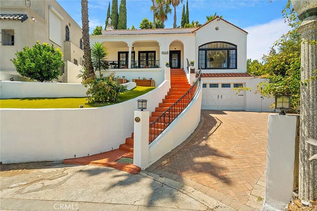 Mediterranean Charm with a Bold Terracotta Staircase