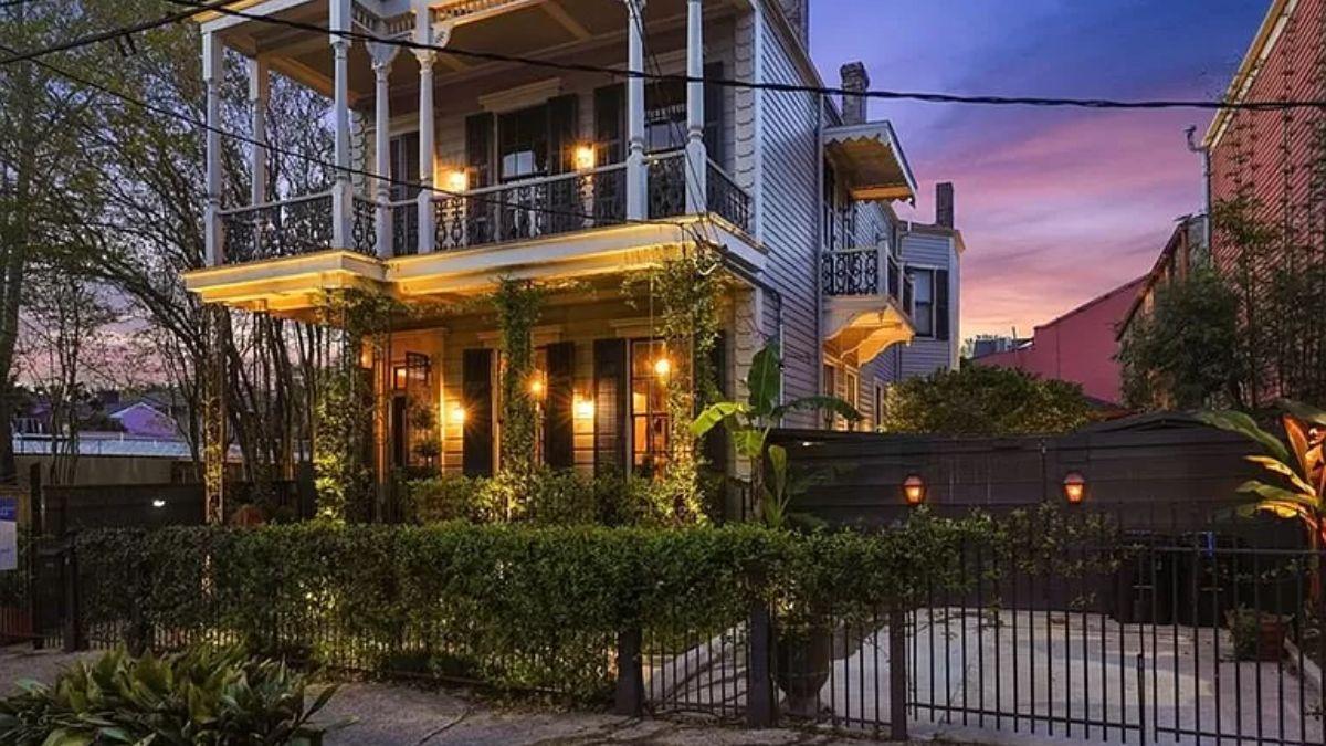 Victorian Elegance with a Wraparound Balcony at Dusk