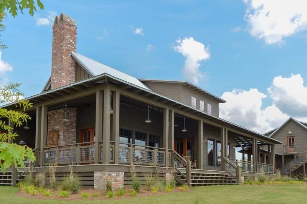 Explore the Wraparound Porch and Brick Chimney of This Rustic Gem