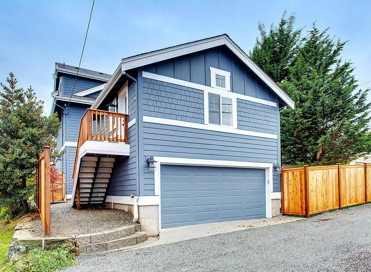 Classic Blue Bungalow with Elevated Entrance and Double Garage