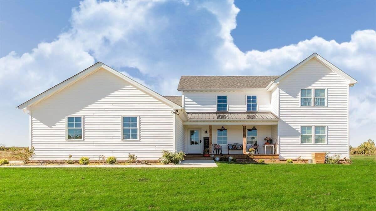 Classic Farmhouse with a Welcoming Porch and Gable Roofs