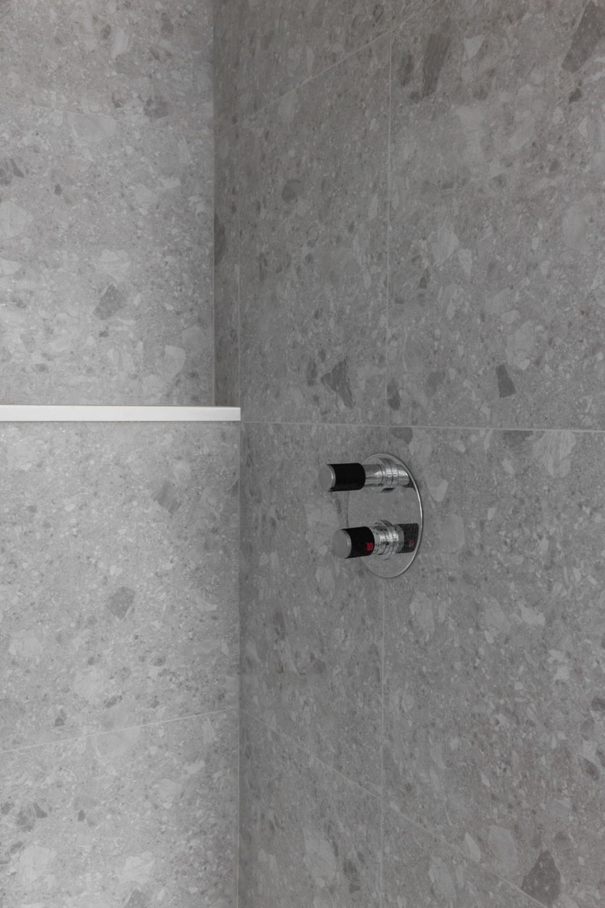 Bathroom tile wall with shower faucet