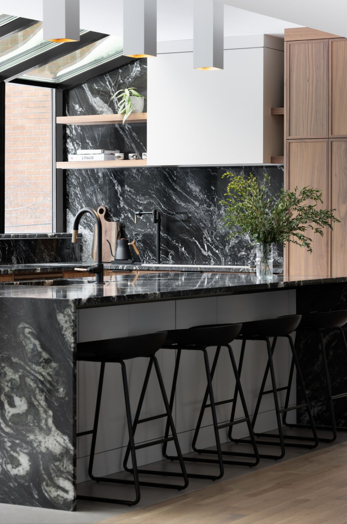 Kitchen island with marble top and chairs