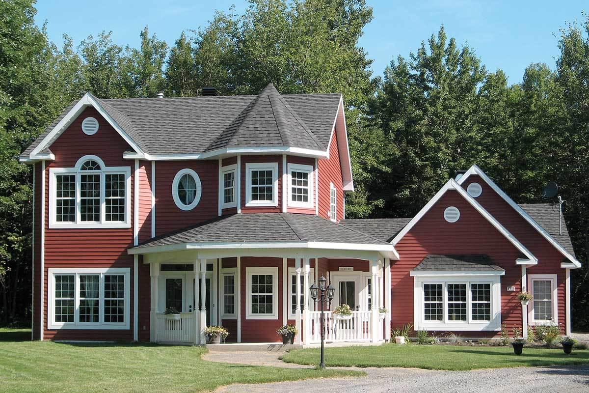 Charming Red Farmhouse with a Unique Octagonal Tower