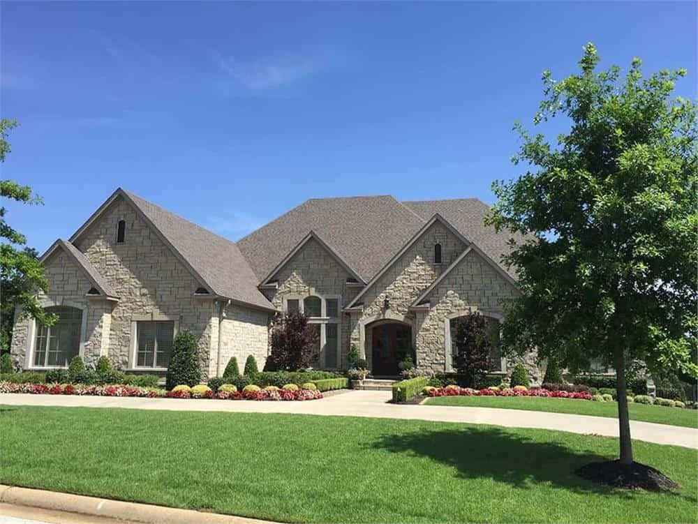 Stone Facade and Gabled Roofs Define This Classic Home