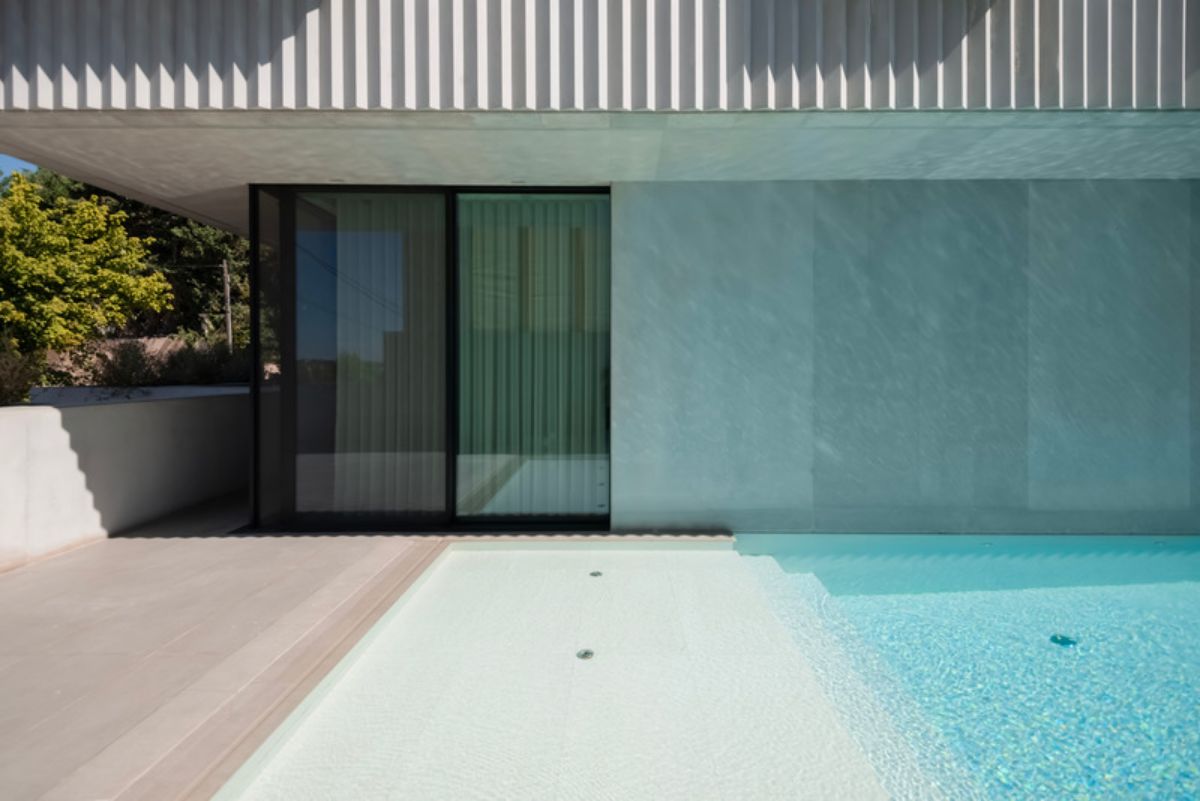 Glass sliding door leading to the pool area