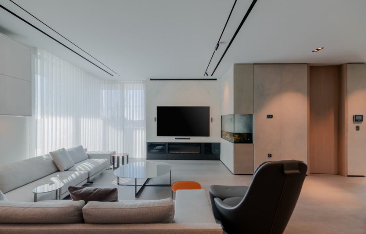 Bright living room with white sofa and glass center table