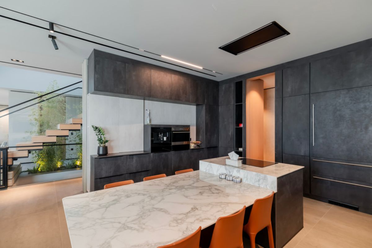 Marble table top with chairs and dark gray cabinet