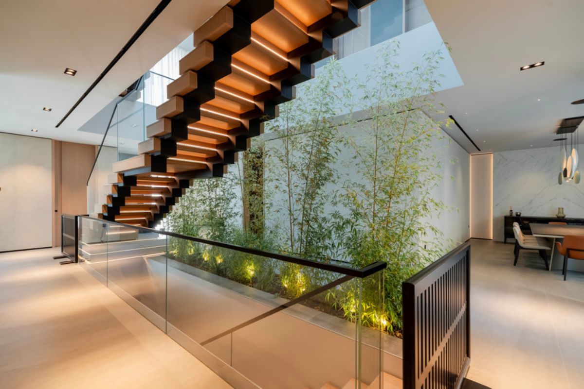 View beneath the staircase with plants 