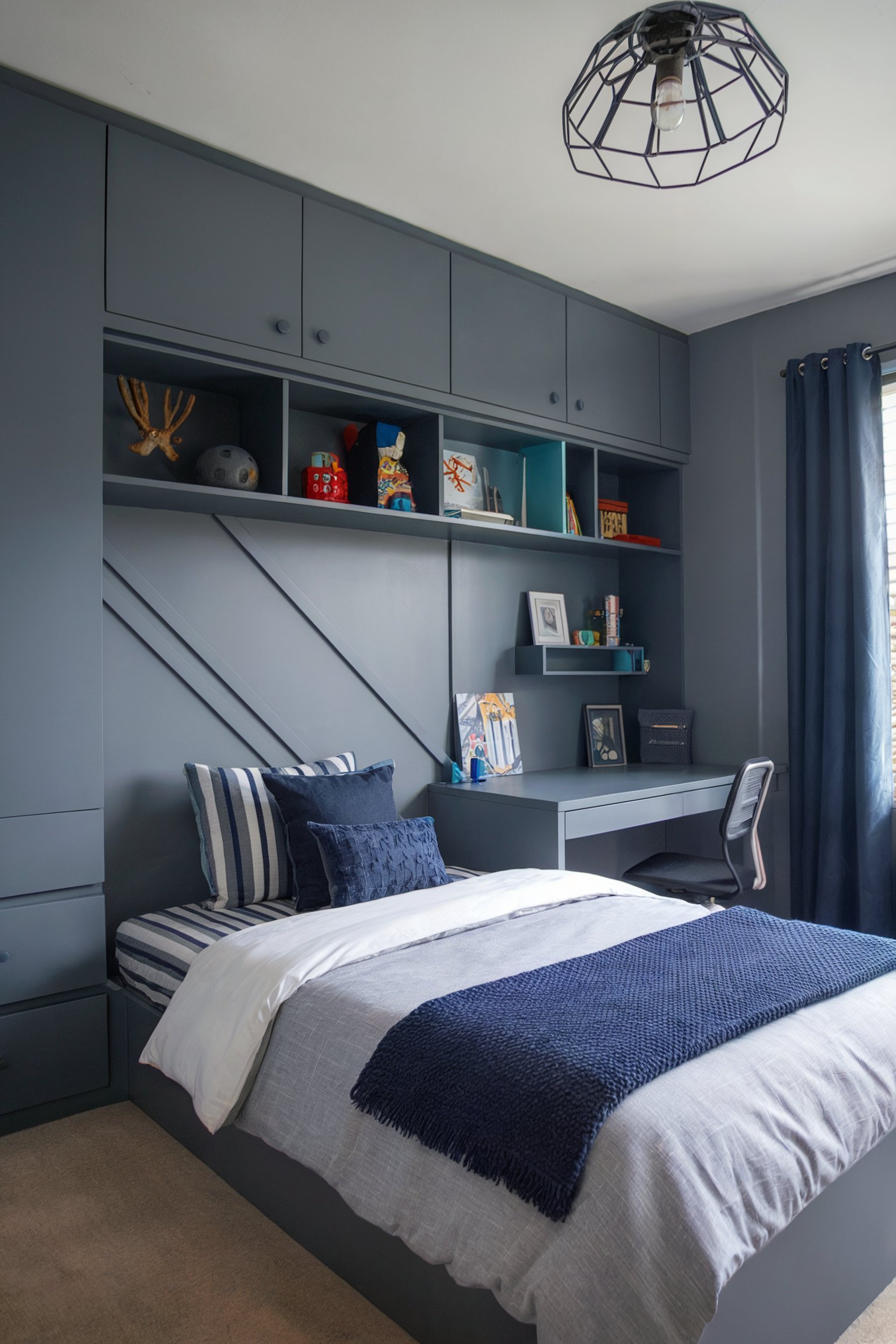 Dark grey bedroom with built-in storage, a workspace, and a bed decorated with navy accents