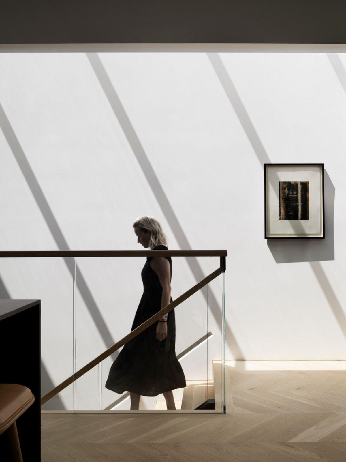 White wall and glass panels of the stairs 