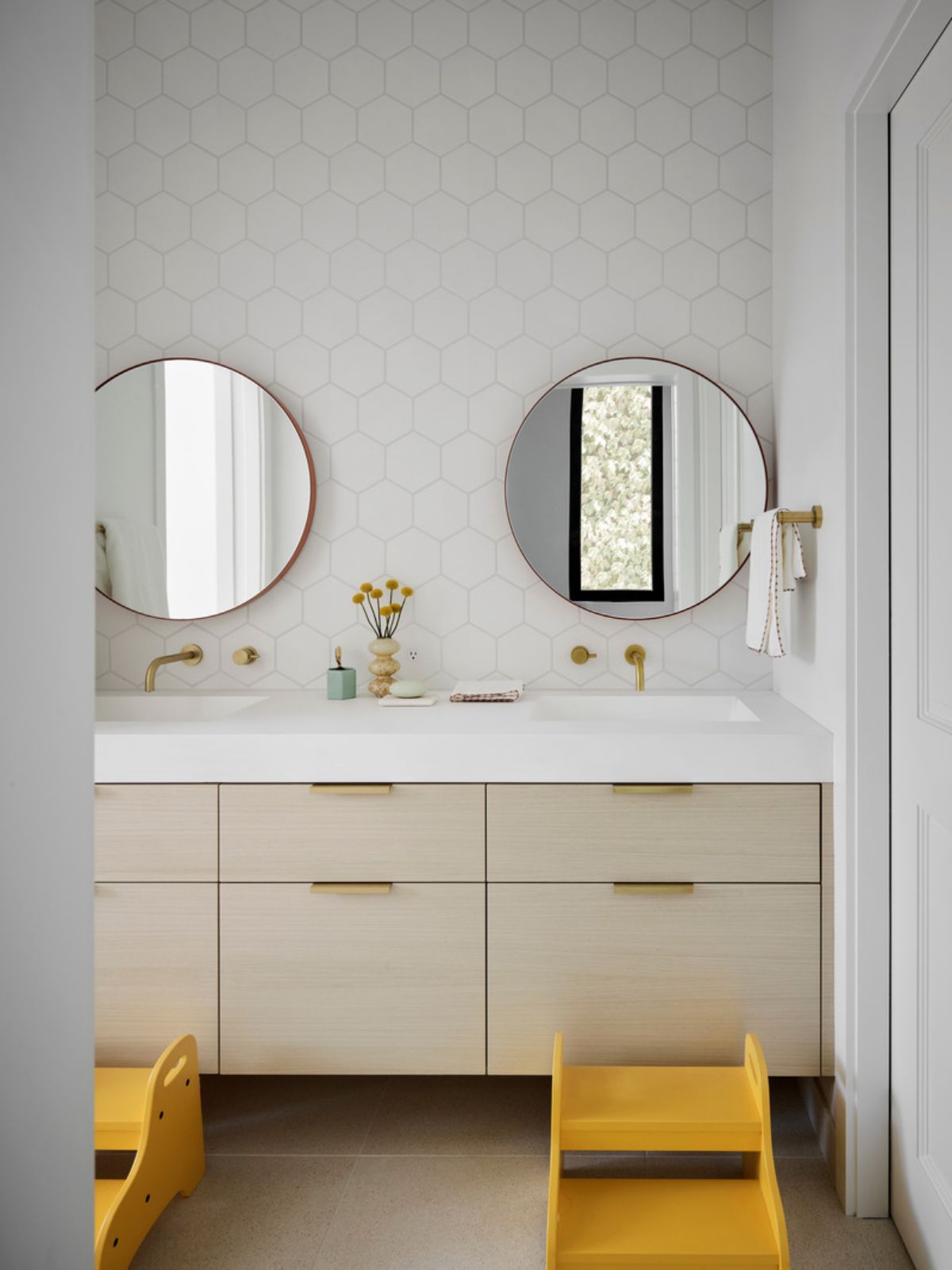 The pocket door (right) is from Trustile; the sinks are from MTI.