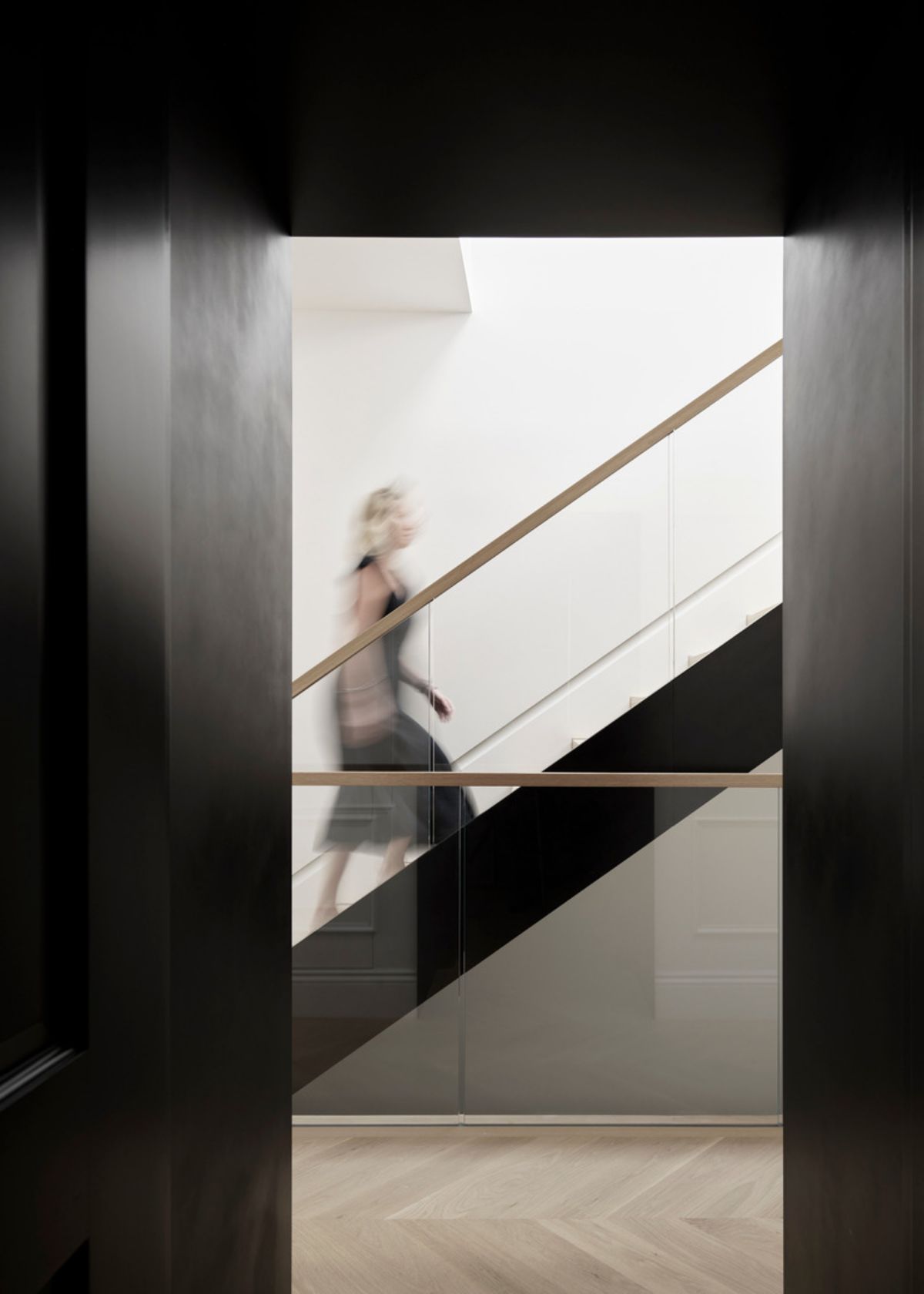 The residence is a harmonious interplay of traditional and modern aesthetics, light and shadow
