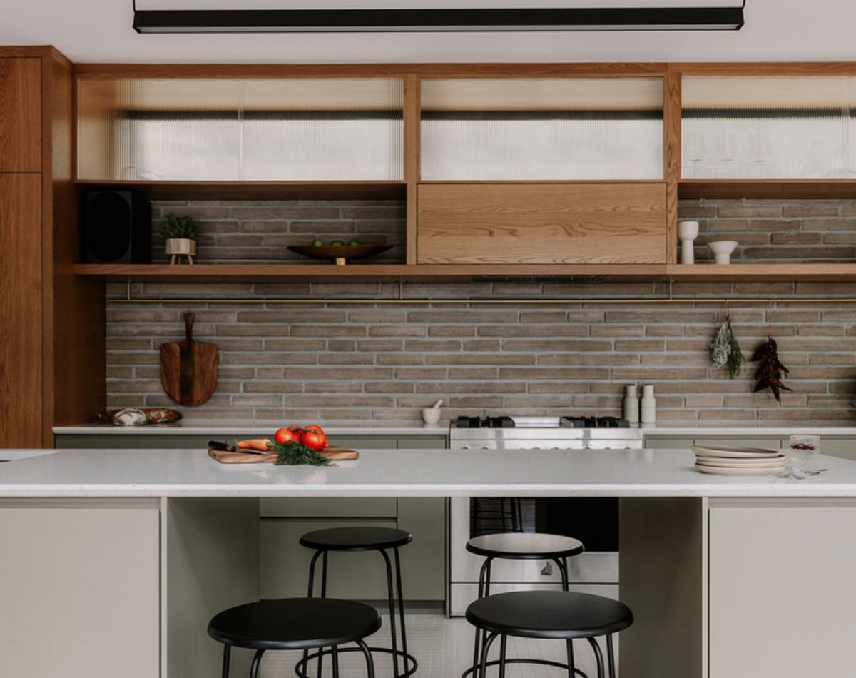 Kitchen cabinets and kitchen island with chairs