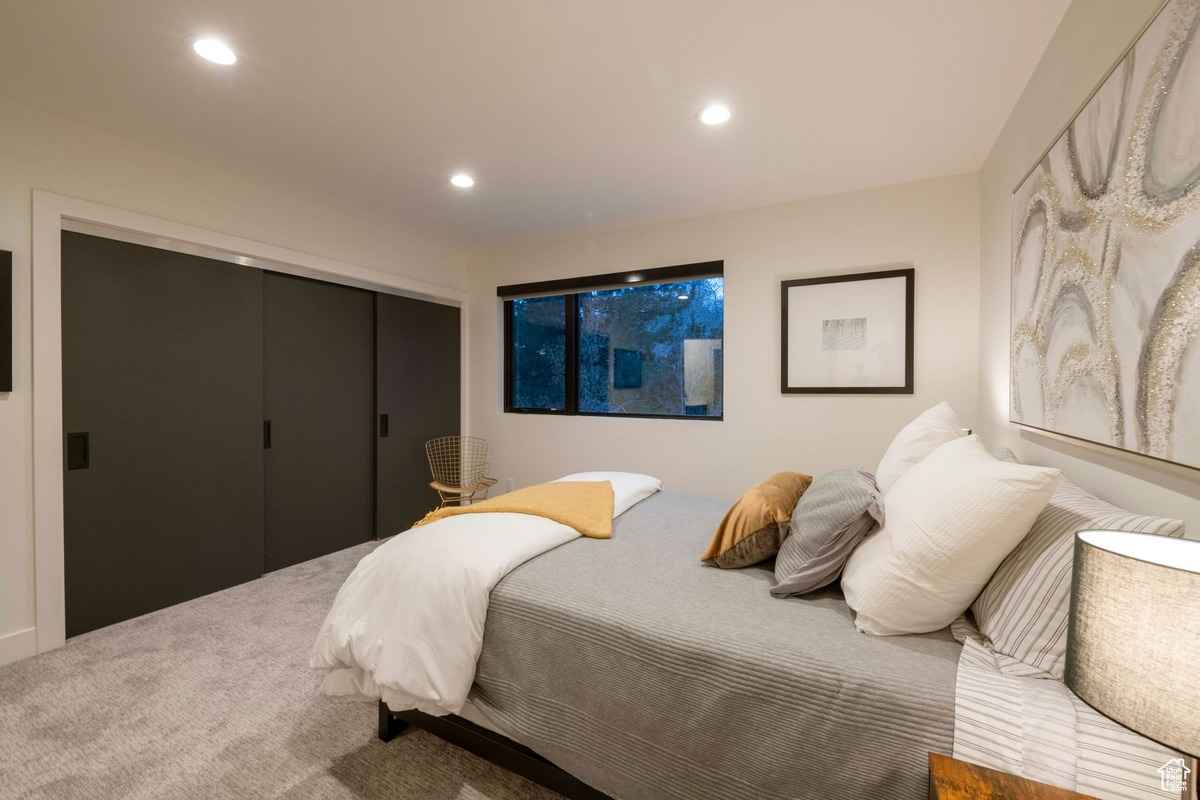 A guest bedroom with a simple, minimalist design.