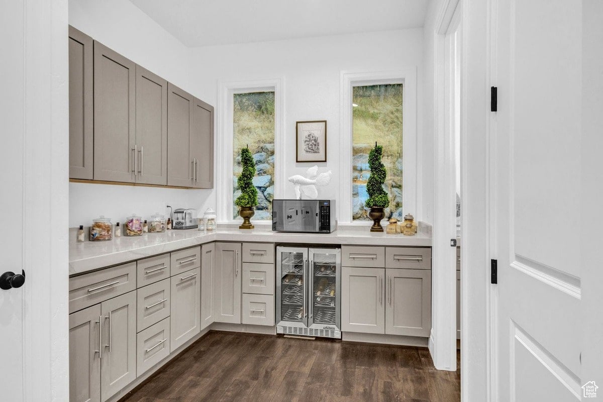 This butler's pantry is depicted in a photograph that showcases its functionality and elegant design. The ample counter space, cabinetry, and built-in appliances create a seamless and efficient workspace within the home.
