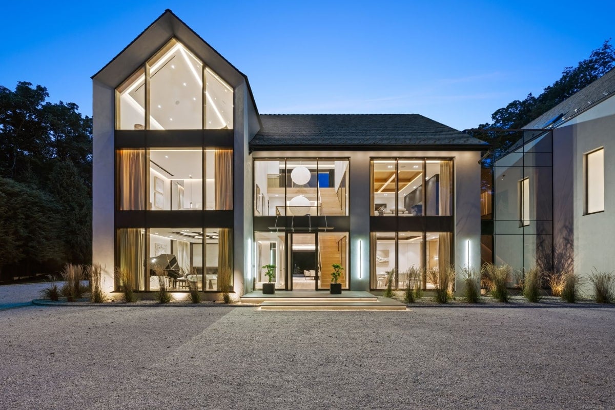 Mansion's exterior at night.