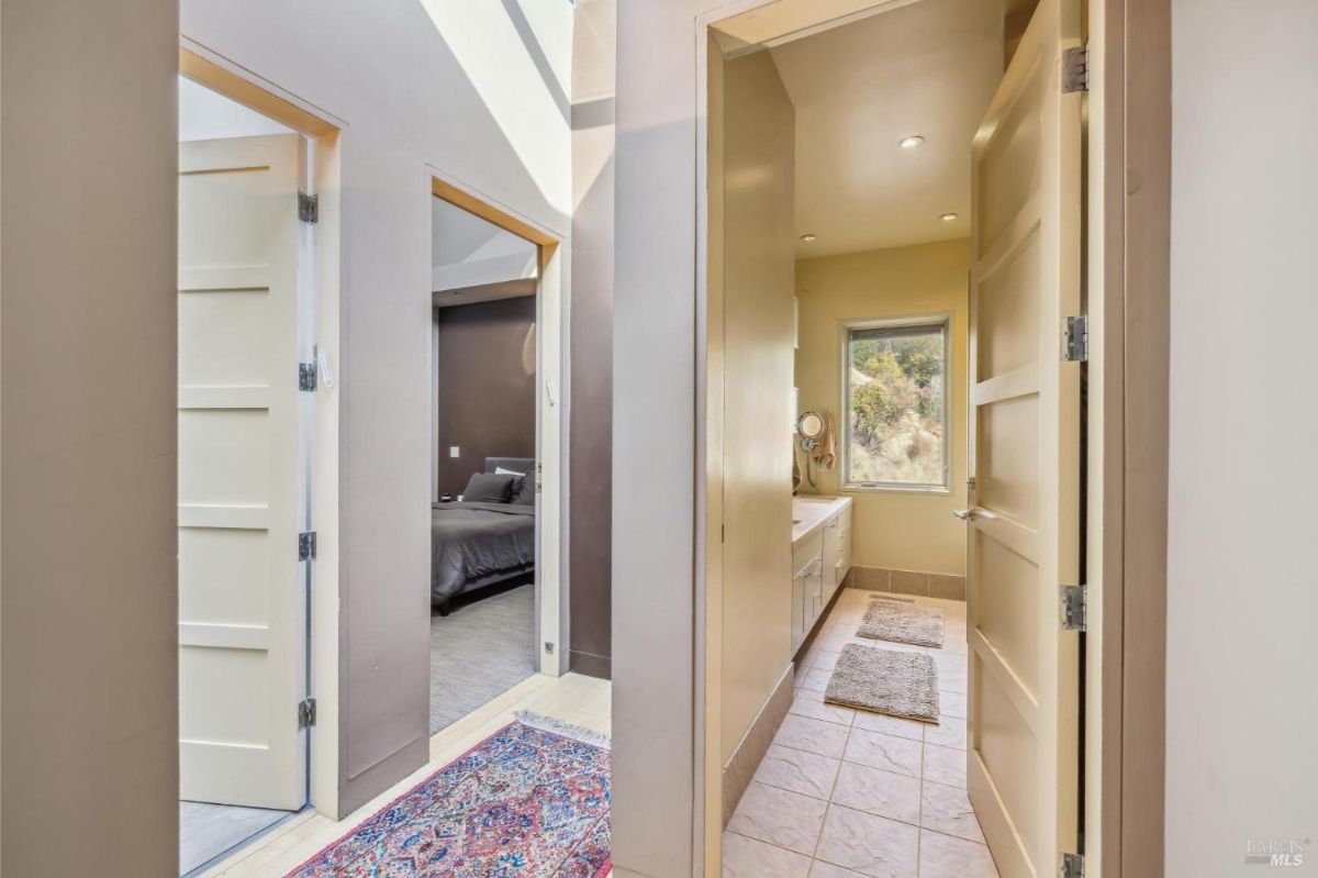 Hallway with access to a bedroom and bathroom.