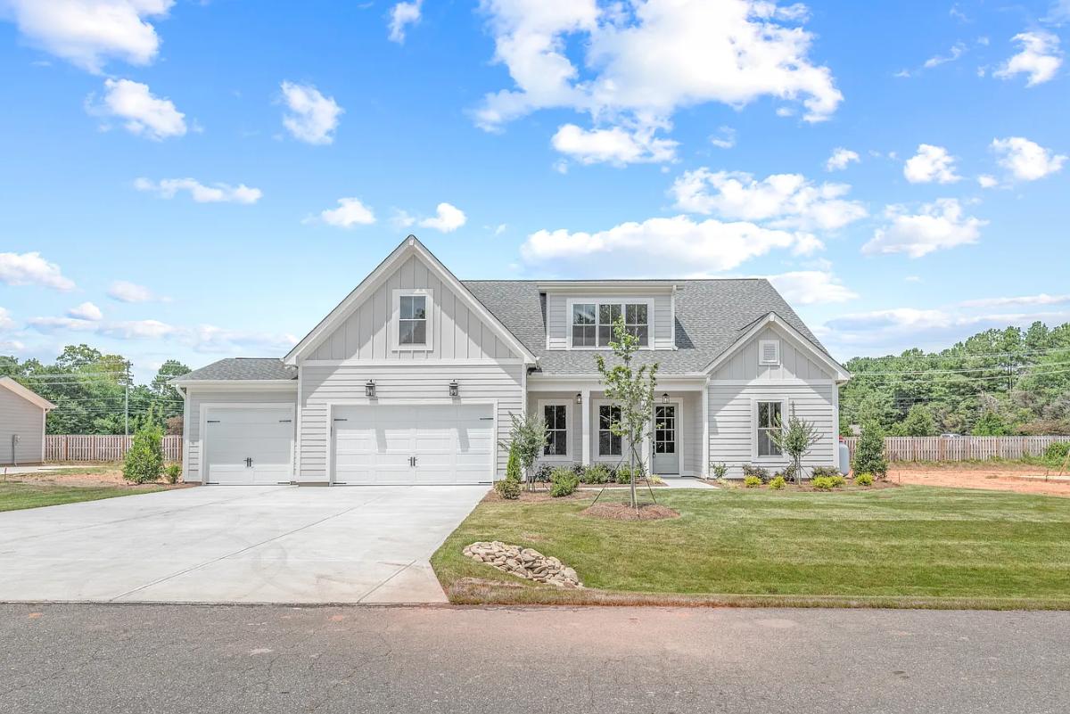 Traditional 3-Bedroom Home with Front Porch and 3-Car Garage (2,584 Sq. Ft. Floor Plan)