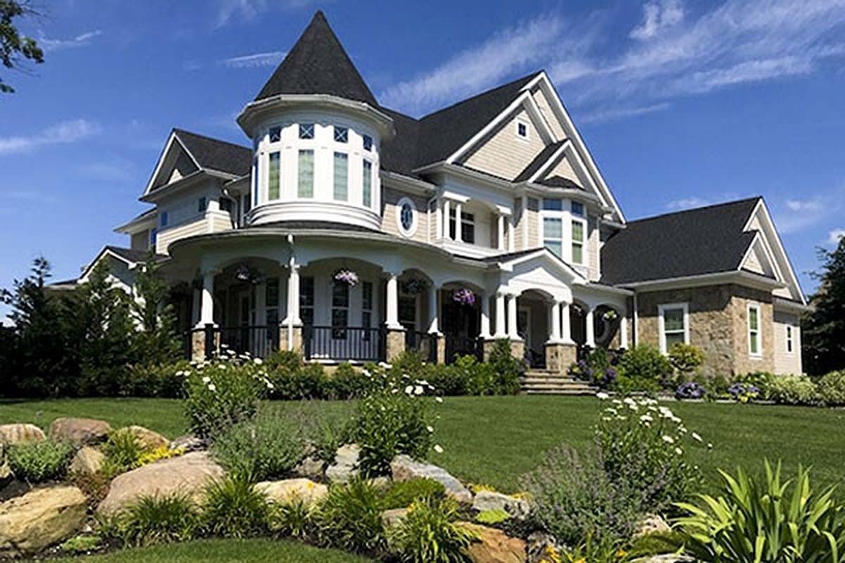 Victorian-Inspired Home with Striking Turret and Wraparound Porch