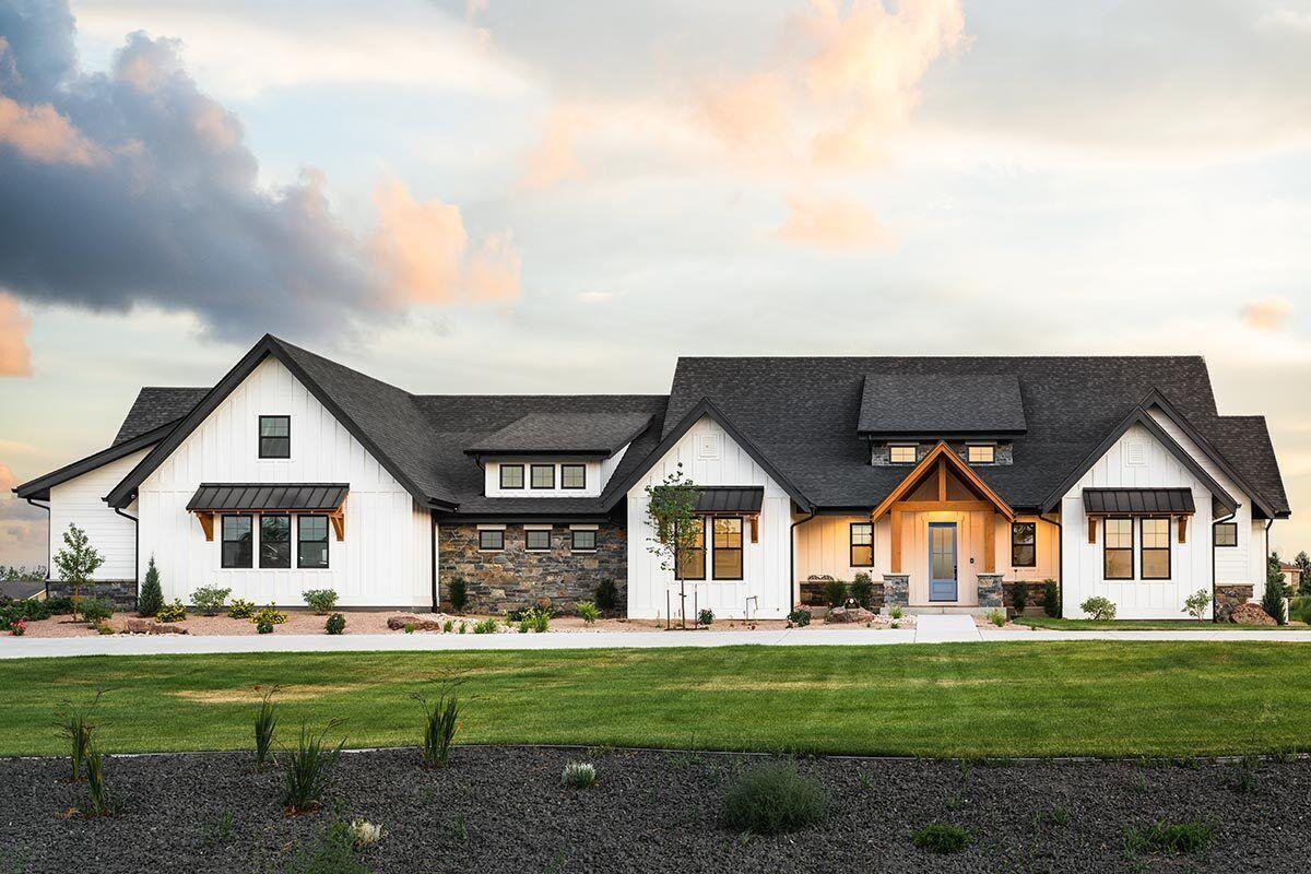 Modern Farmhouse with Striking Stone Accents and Gabled Roofline