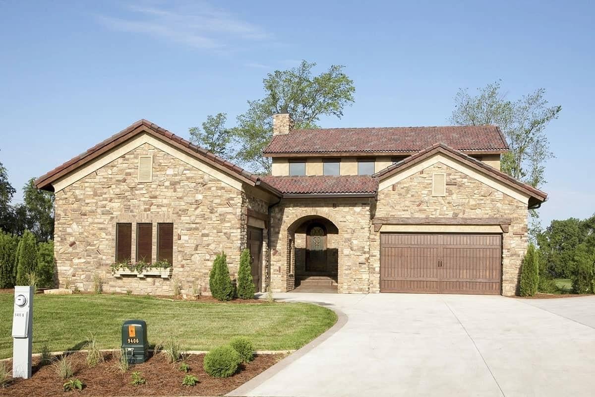 Explore This Stone Facade Home with a Double Garage