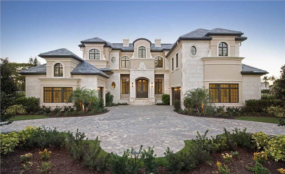 Grand Facade with Distinctive Arched Windows and Slate Roof