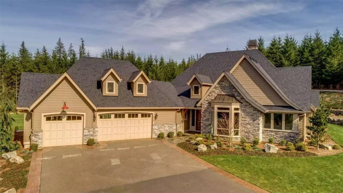 Classic Craftsman Home with Dual Dormers and Stone Facade