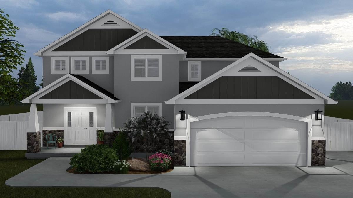 Classic Two-Story Home with Stone Accents and Symmetrical Design