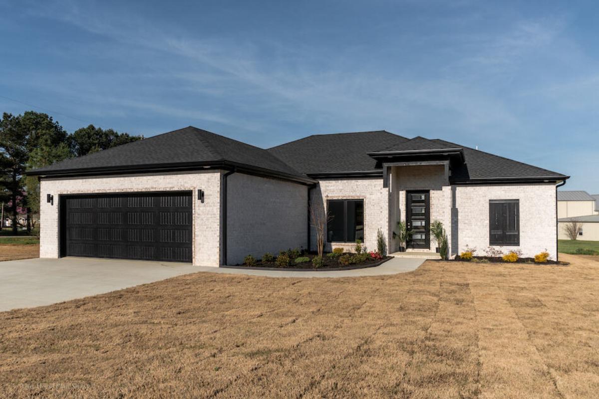 Check Out the Striking Black Garage Doors on This Modern Ranch