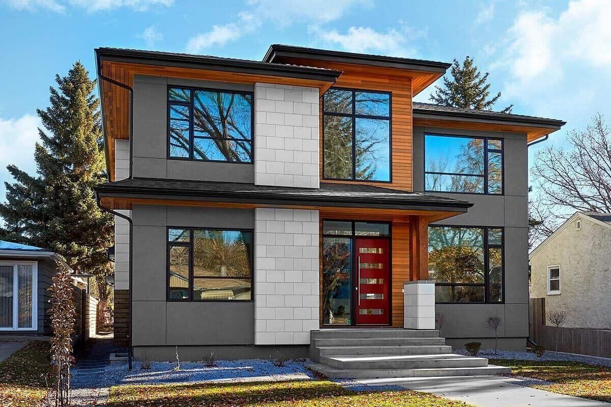Modern Facade with Bold Red Door and Contrasting Panels
