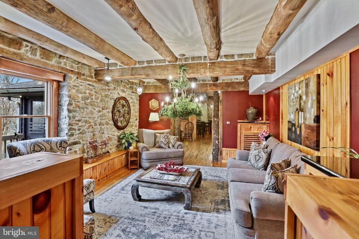 Warm and inviting family room blending stone and wood elements with stylish decor.