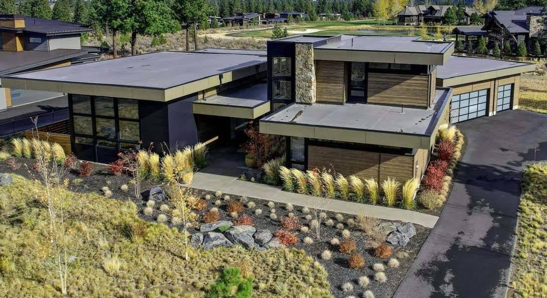 Modern Home with Striking Flat Rooflines and Natural Landscaping