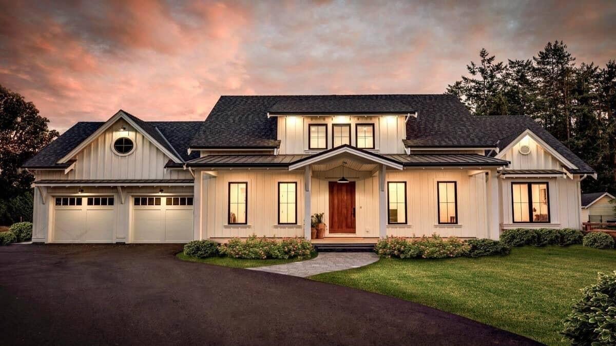 Classic Farmhouse Facade with Warm Evening Glow