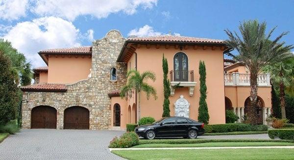 Mediterranean Villa with Striking Stone Facade and Arched Windows