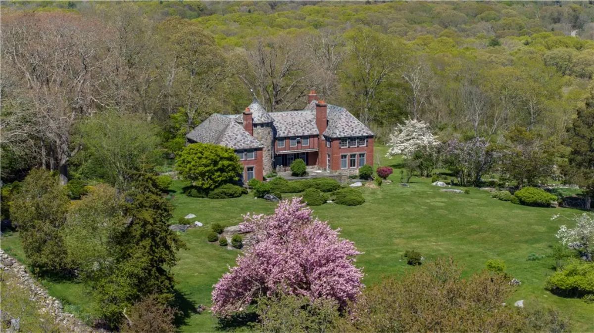 Priced at $3,250,000, this 1926 Tudor-style estate offers 5,652 square feet of living space with 6 bedrooms and 4 baths.