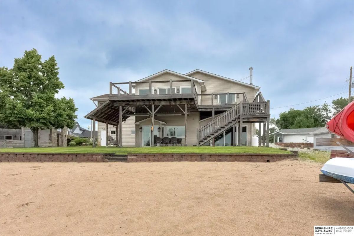 This home in Bellevue is listed at $845,500. This 2,892 sq. ft. 3-bedroom, 3-bathroom two-story home, built in 1950, is situated on a prime lot at Hanson Lake 2, offering luxury living with a private beachfront and stunning lake views.