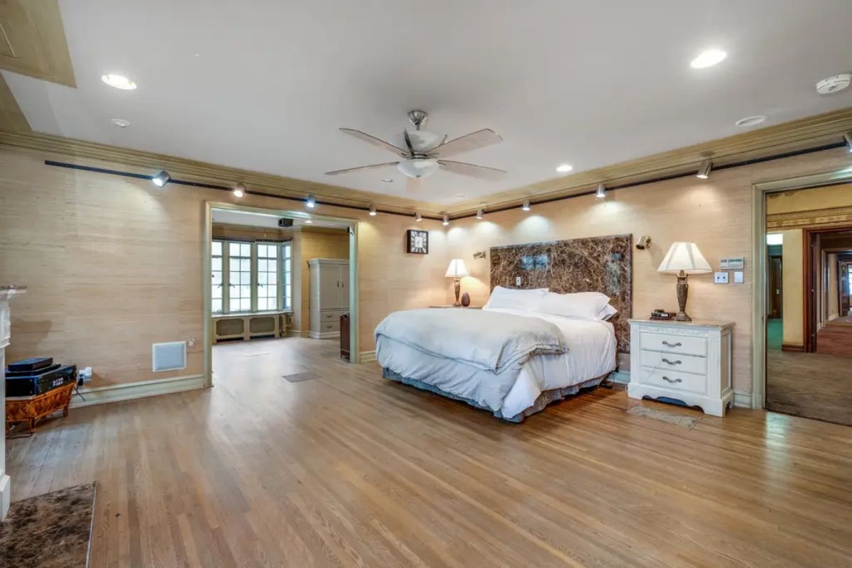 A large layout with light wood flooring and neutral walls.