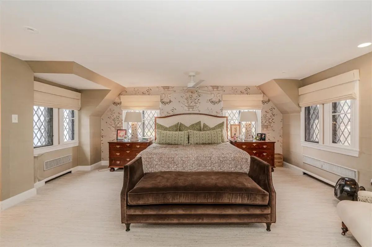 Layout with dormer windows and lattice-style glass accents.
