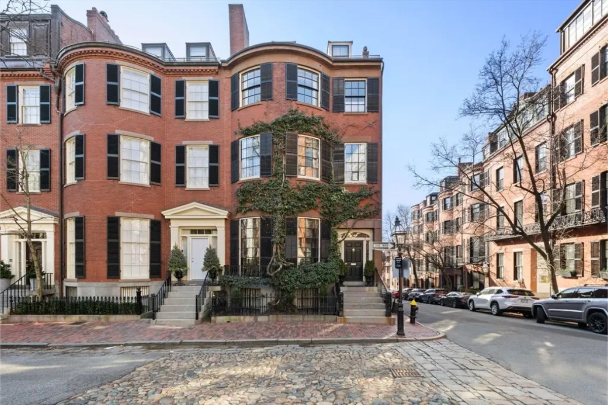 This $17,990,000 corner townhouse on Beacon Hill’s prestigious Louisburg Square, built in 1835, offers 7,424 sq ft of elegant living space across six levels with elevator access.